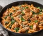 Tiras de pollo con pimientos, cebolla y tortillas calientes